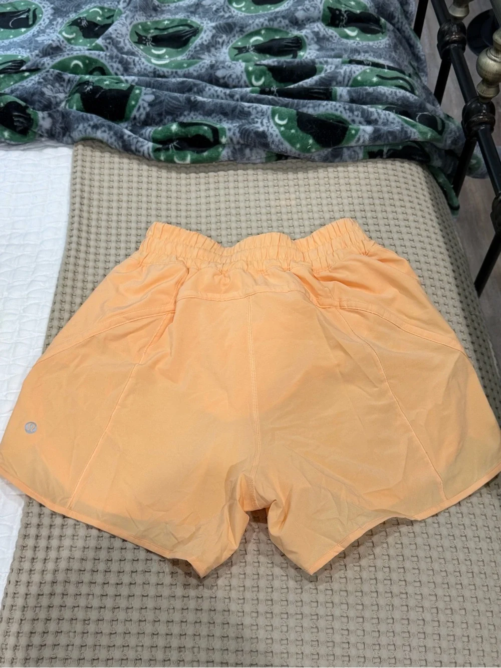 Lululemon track that 5” peach shorts